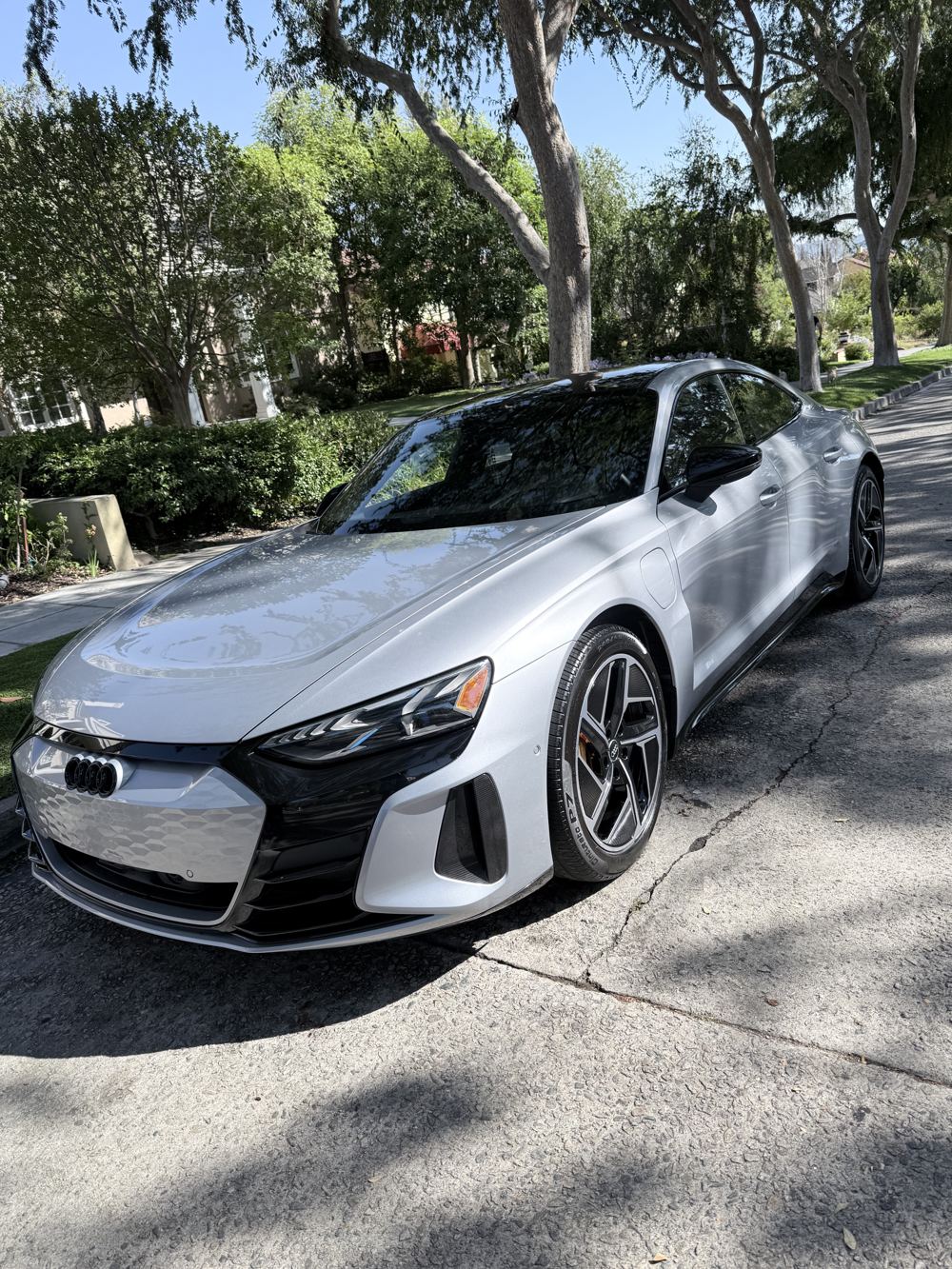 Freshly detailed silver sports sedan with glossy paint