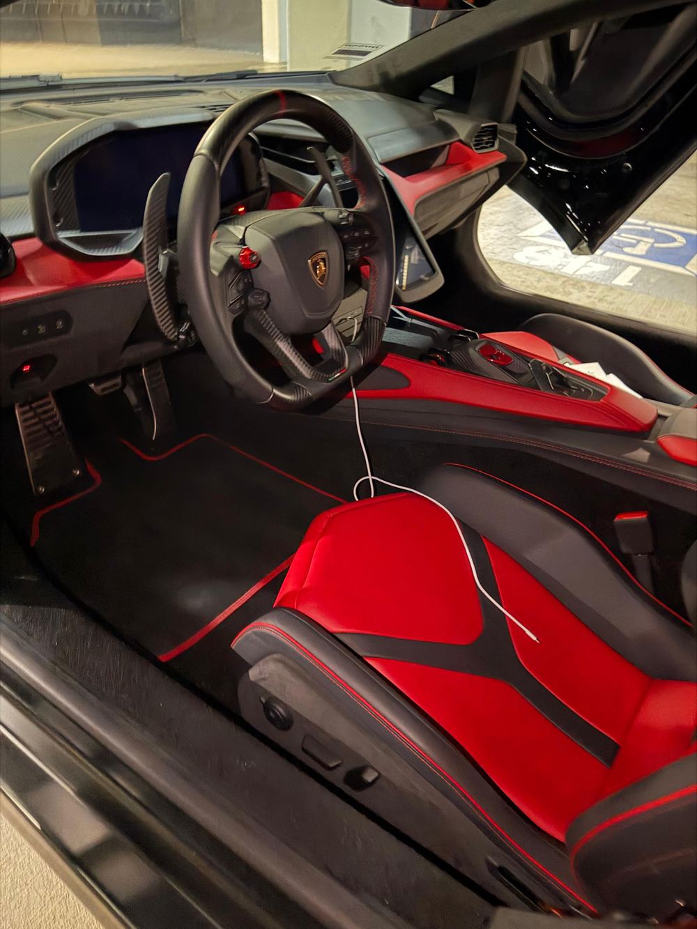 Detailed red and black supercar interior